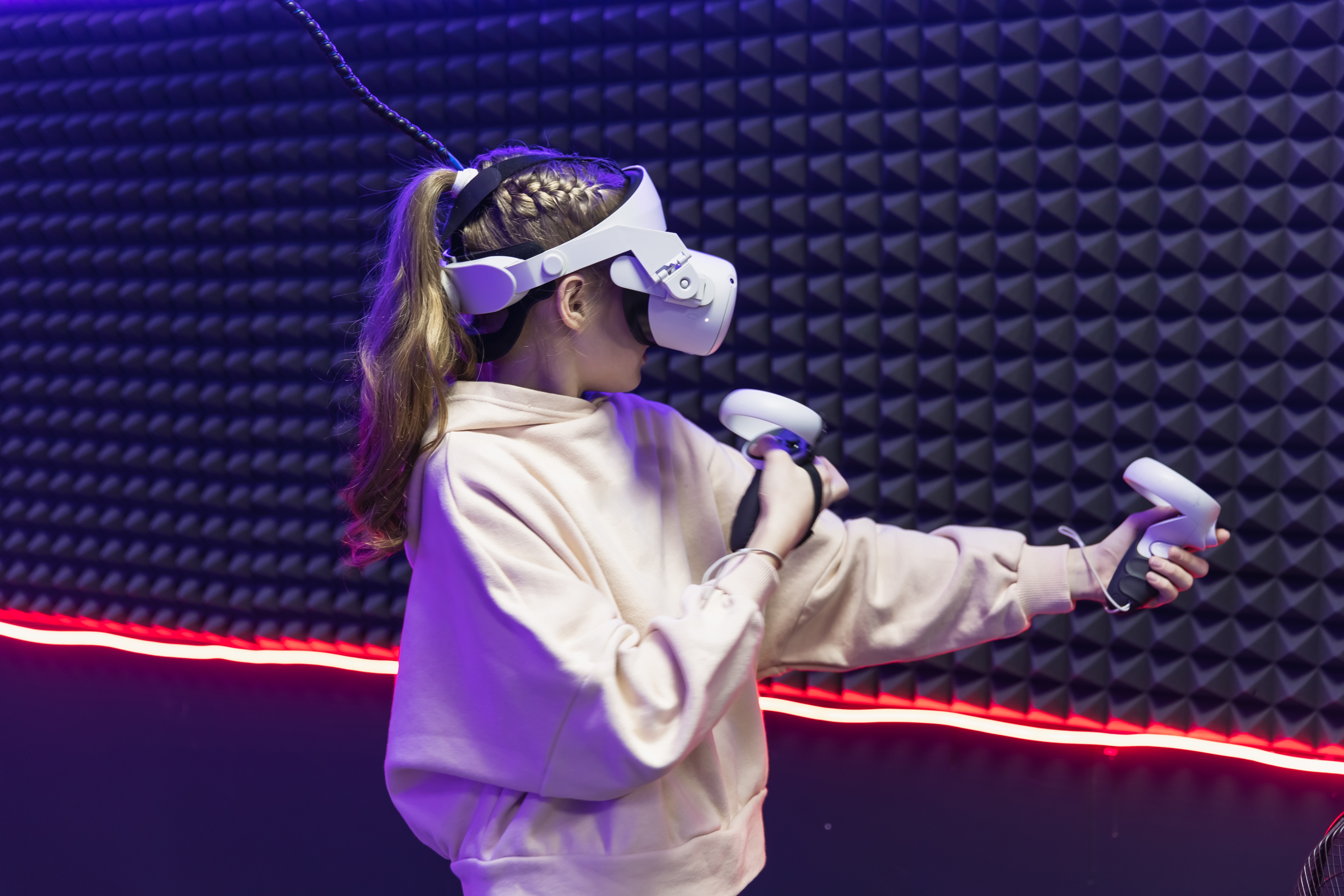 Young woman is playing VR game in glasses. Cyber space and virtual gaming.